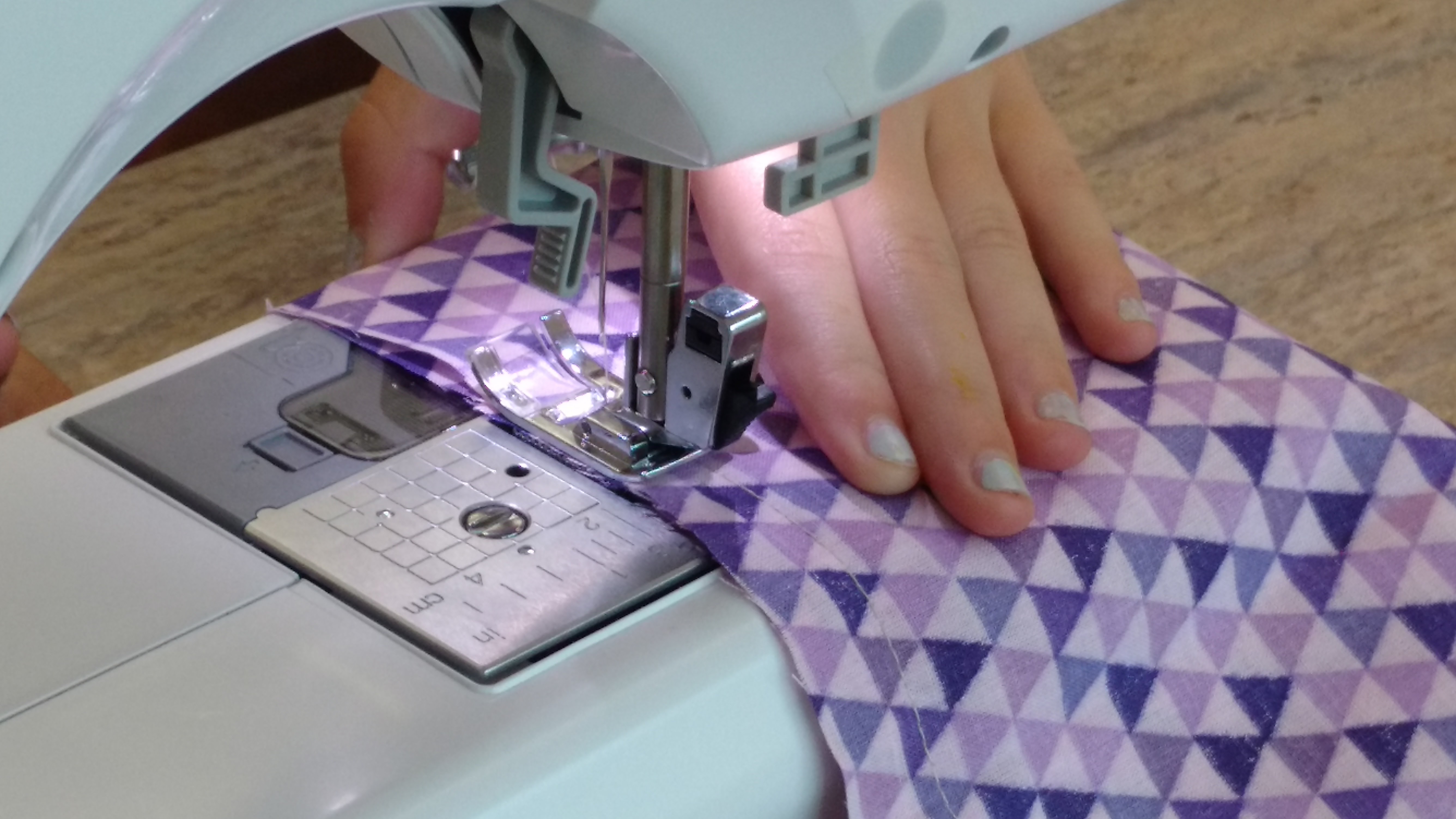 sewing purple fabric